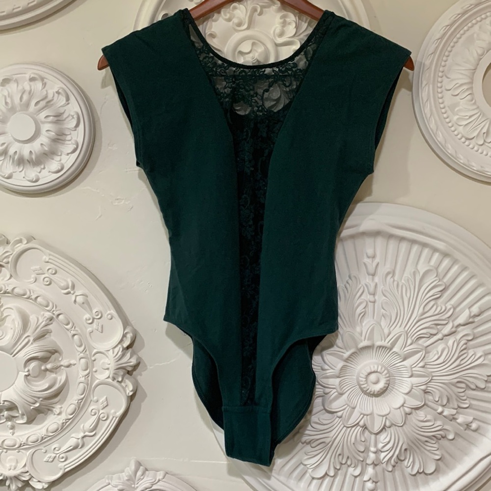 Shirt sleeve body suit